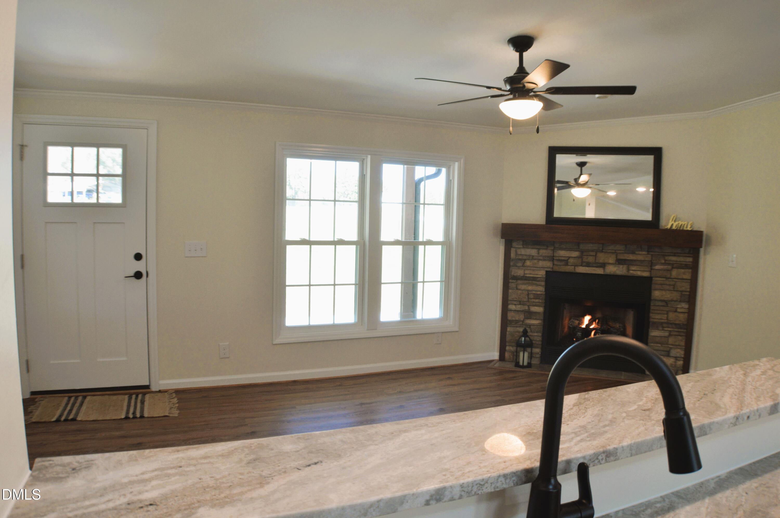 1159 No Bottom Road Warrenton, NC 27589 - Photo 14 of 43 a living room with furniture and a fireplace