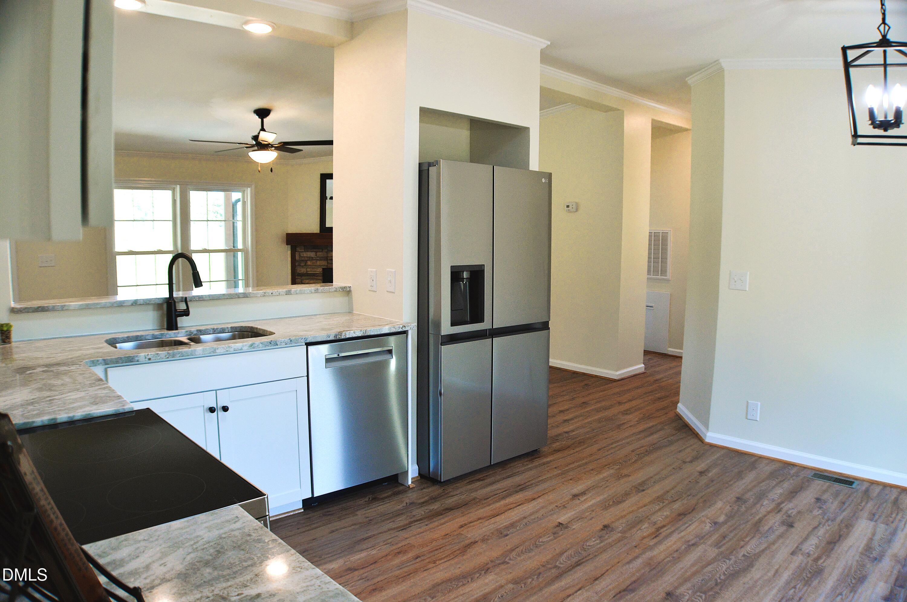 1159 No Bottom Road Warrenton, NC 27589 - Photo 15 of 43 a kitchen with a refrigerator sink and cabinets
