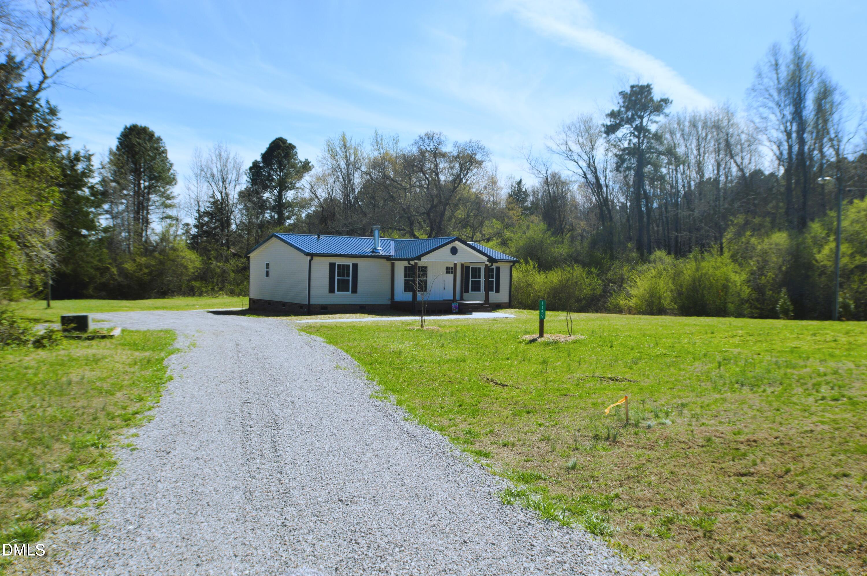 1159 No Bottom Road Warrenton, NC 27589 - Photo 2 of 43 a house view with a outdoor space