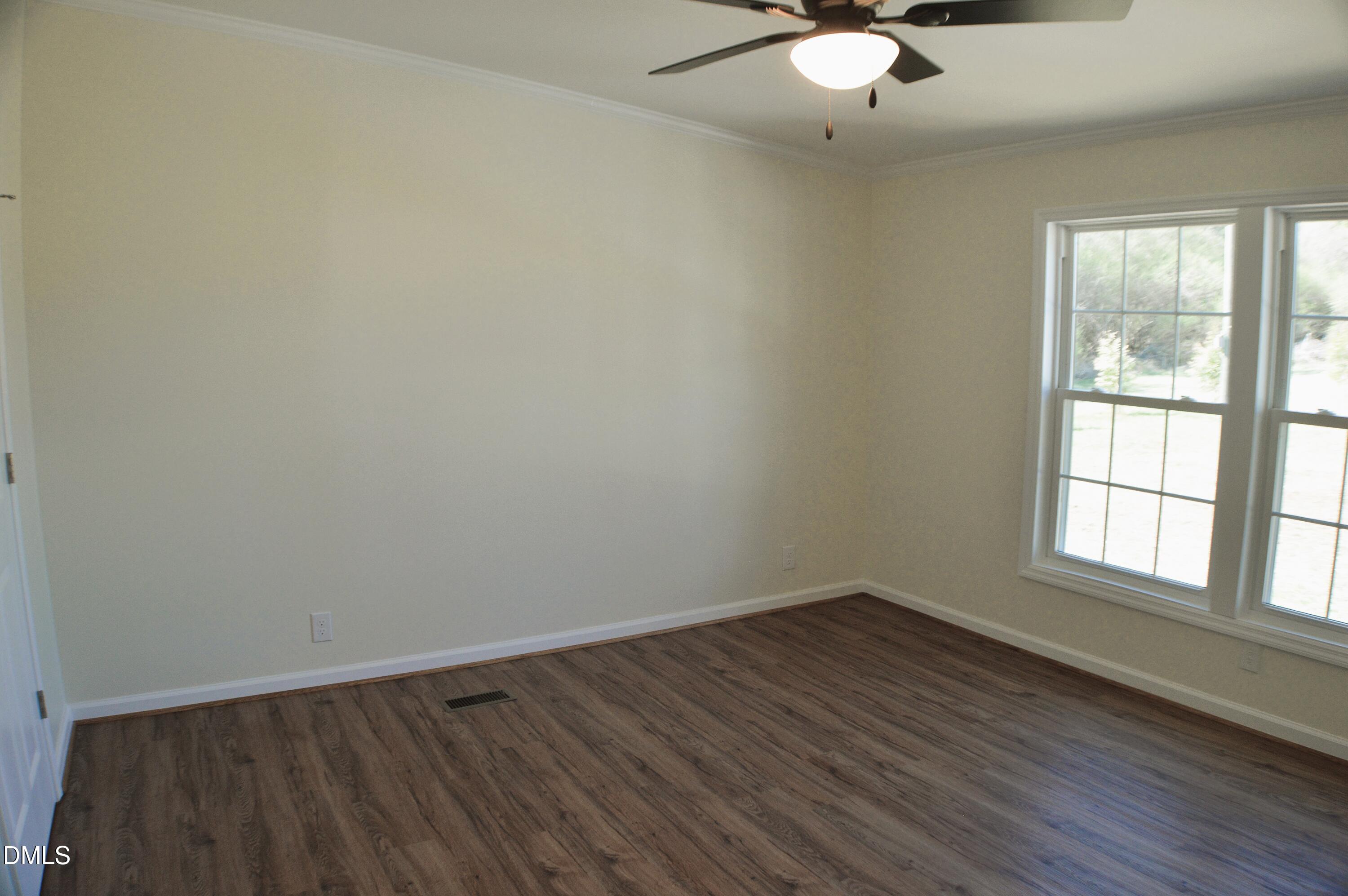 1159 No Bottom Road Warrenton, NC 27589 - Photo 30 of 44 an empty room with wooden floor and windows