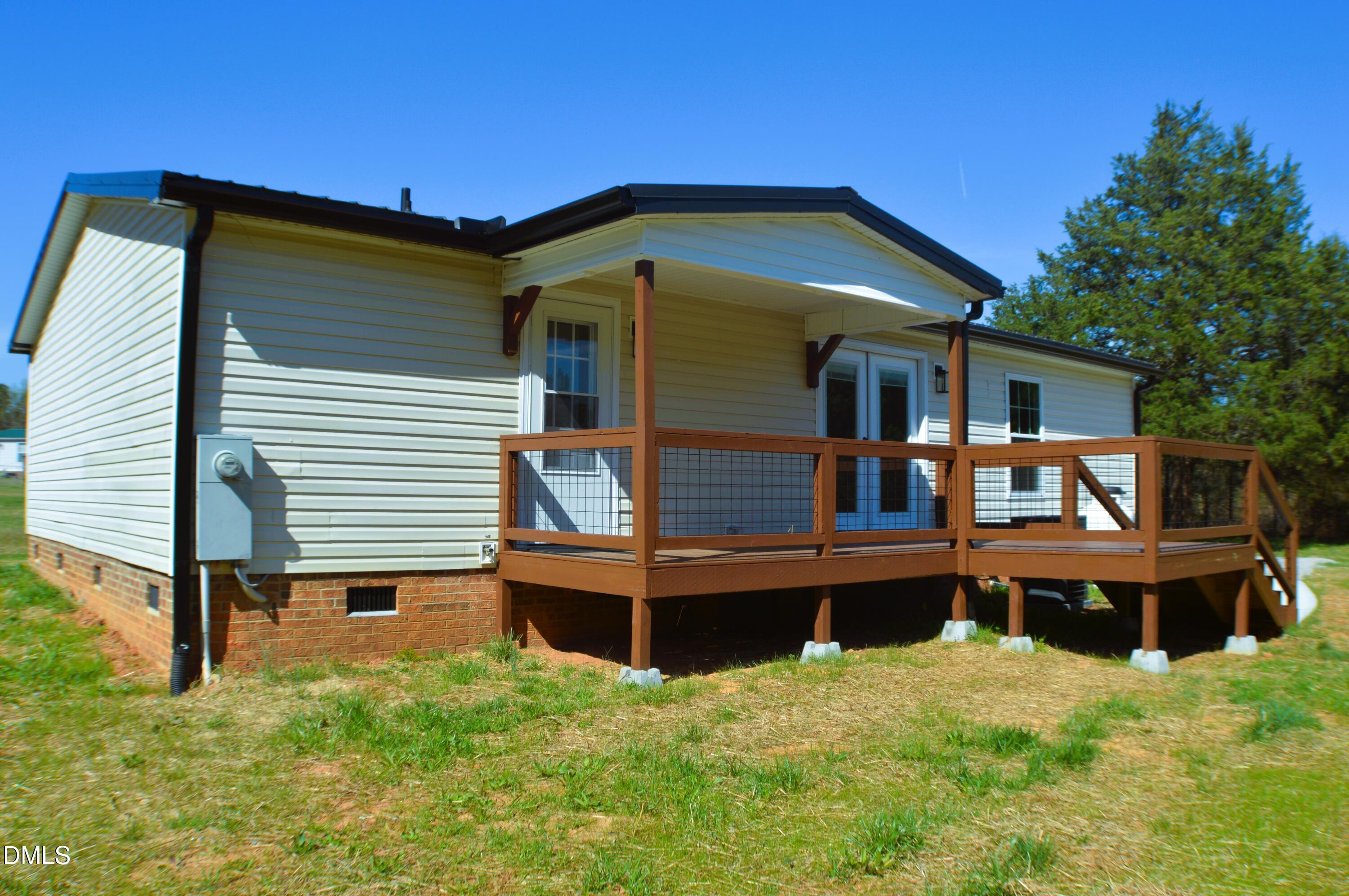 1159 No Bottom Road Warrenton, NC 27589 - Photo 34 of 43 a front view of a house with wooden fence