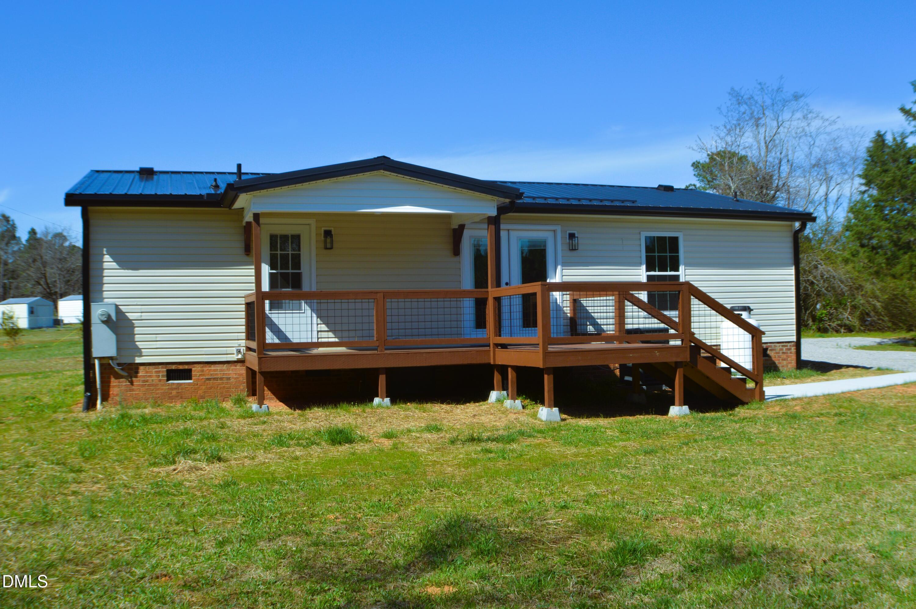 1159 No Bottom Road Warrenton, NC 27589 - Photo 35 of 43 a front view of a house with garden