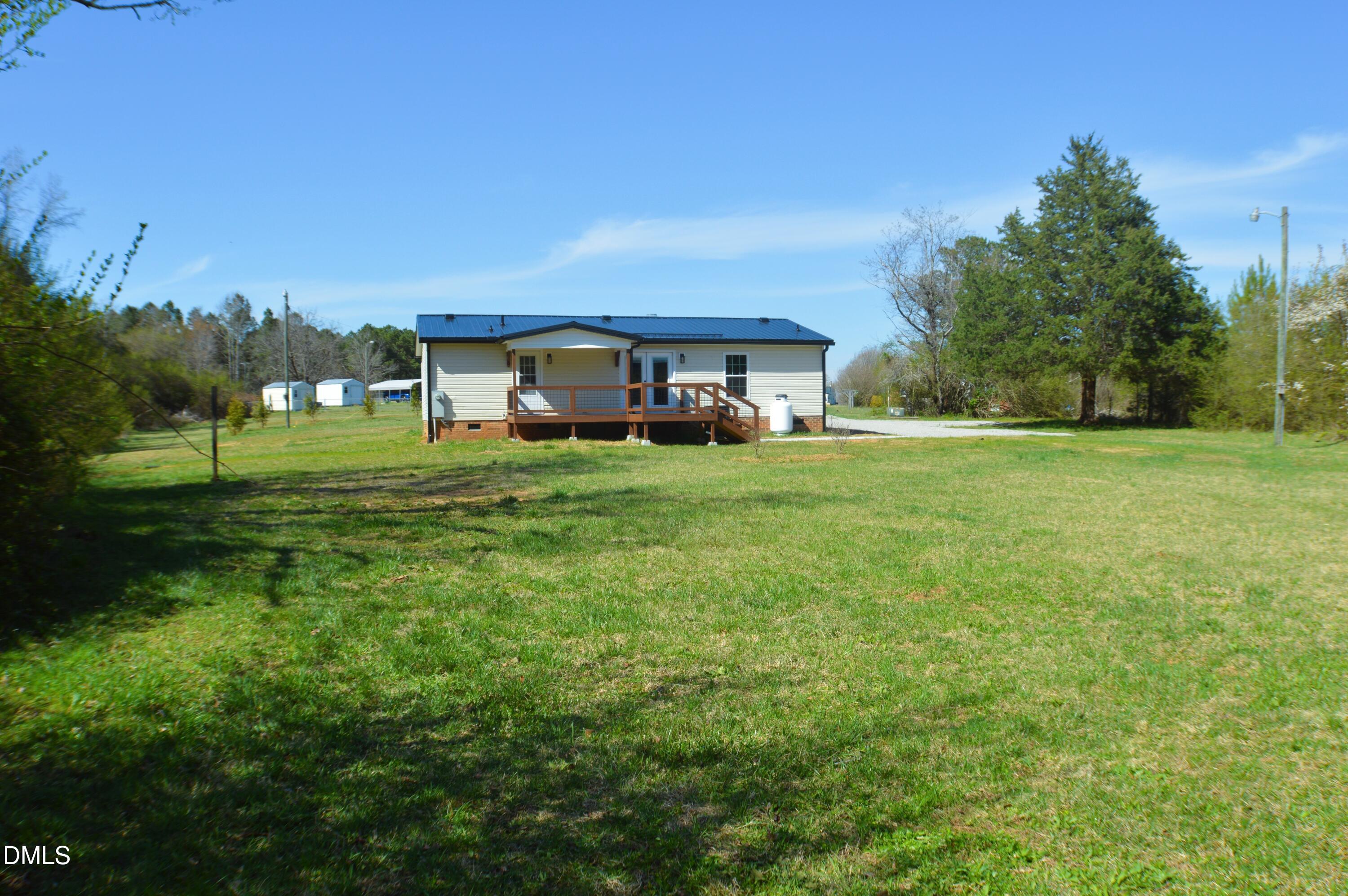 1159 No Bottom Road Warrenton, NC 27589 - Photo 37 of 43 a view of a big yard with a house in the background
