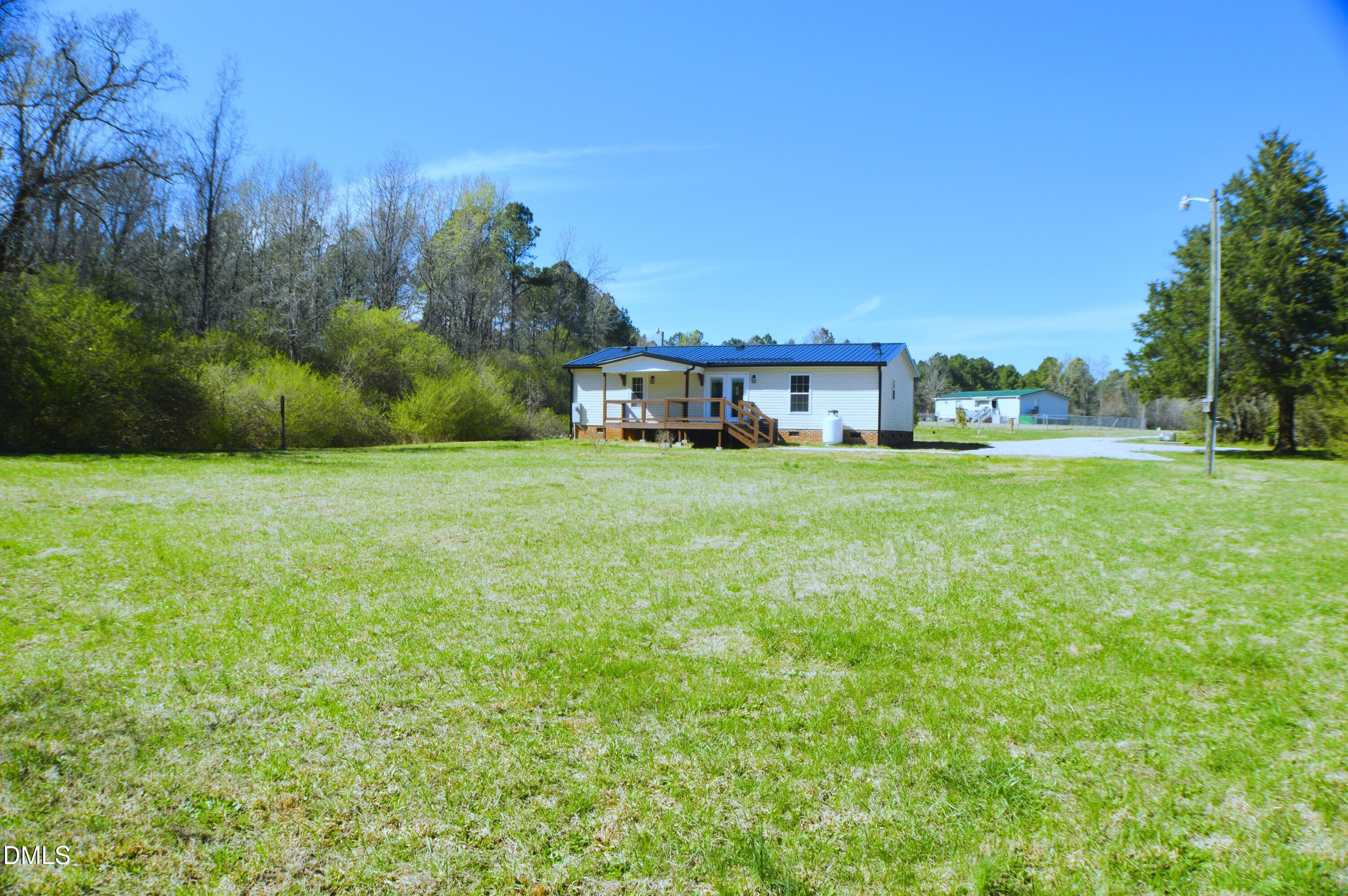 1159 No Bottom Road Warrenton, NC 27589 - Photo 38 of 43 a view of a large garden with plants and large trees
