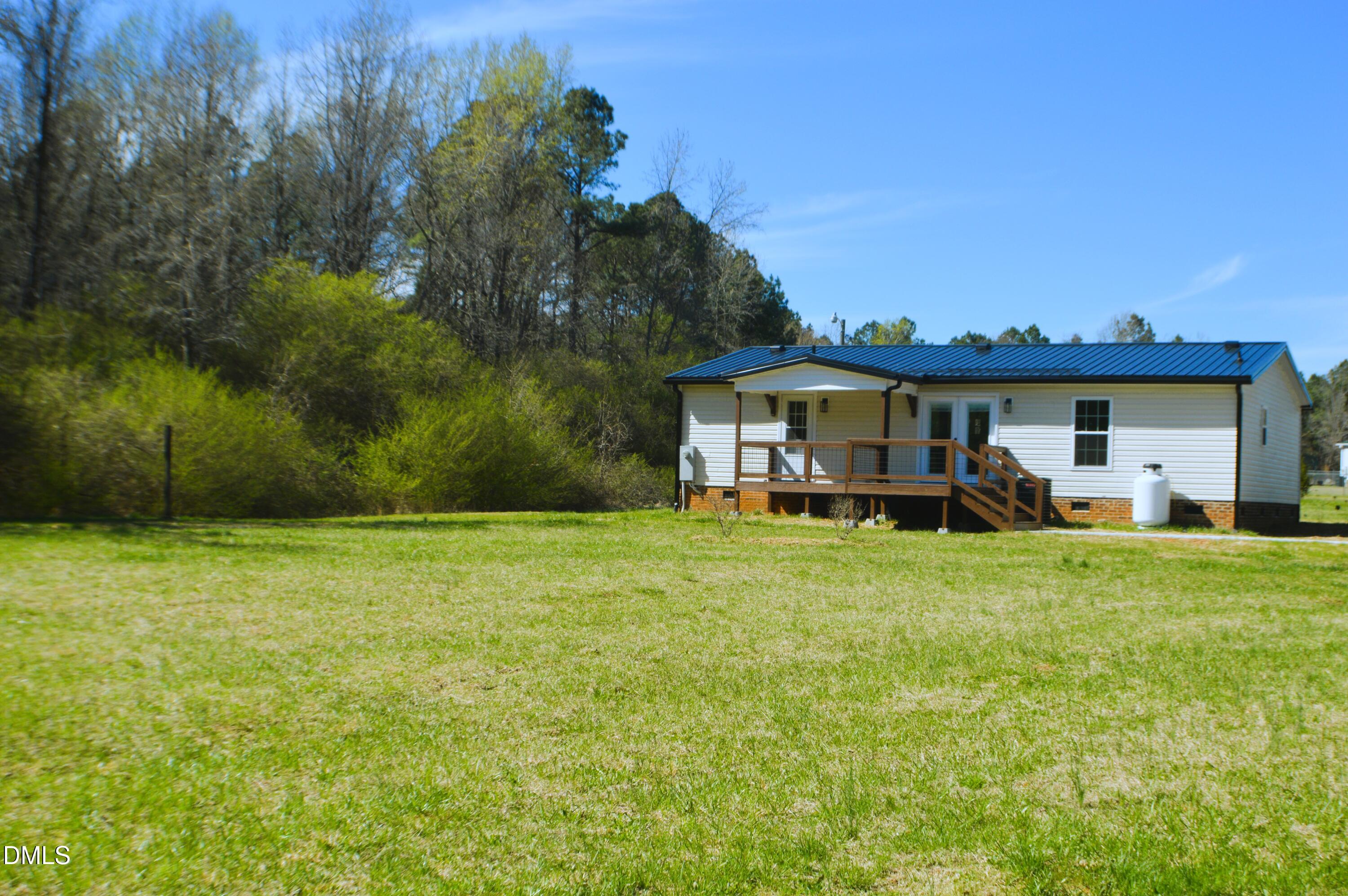 1159 No Bottom Road Warrenton, NC 27589 - Photo 39 of 43 a front view of a house with a garden