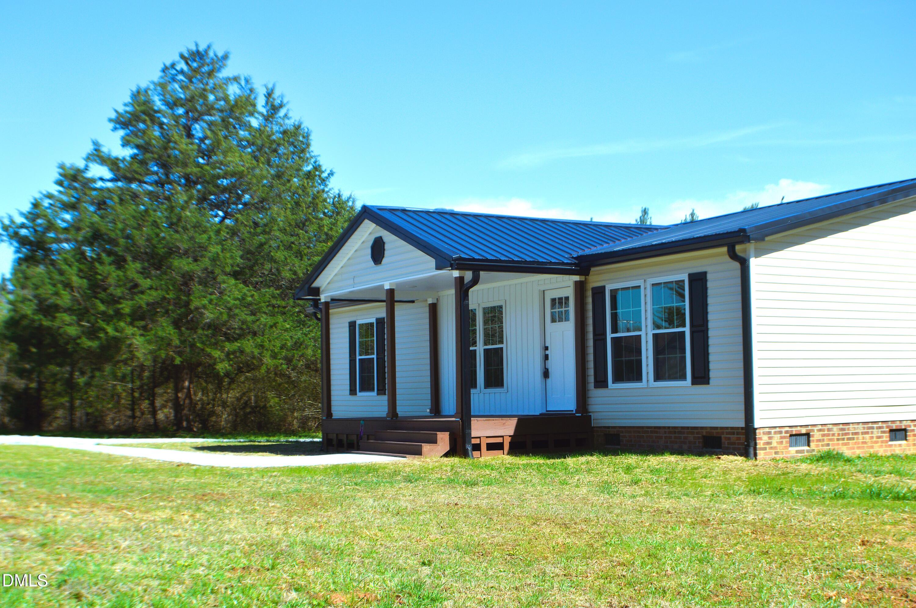 1159 No Bottom Road Warrenton, NC 27589 - Photo 41 of 43 a view of a house with backyard porch and garden