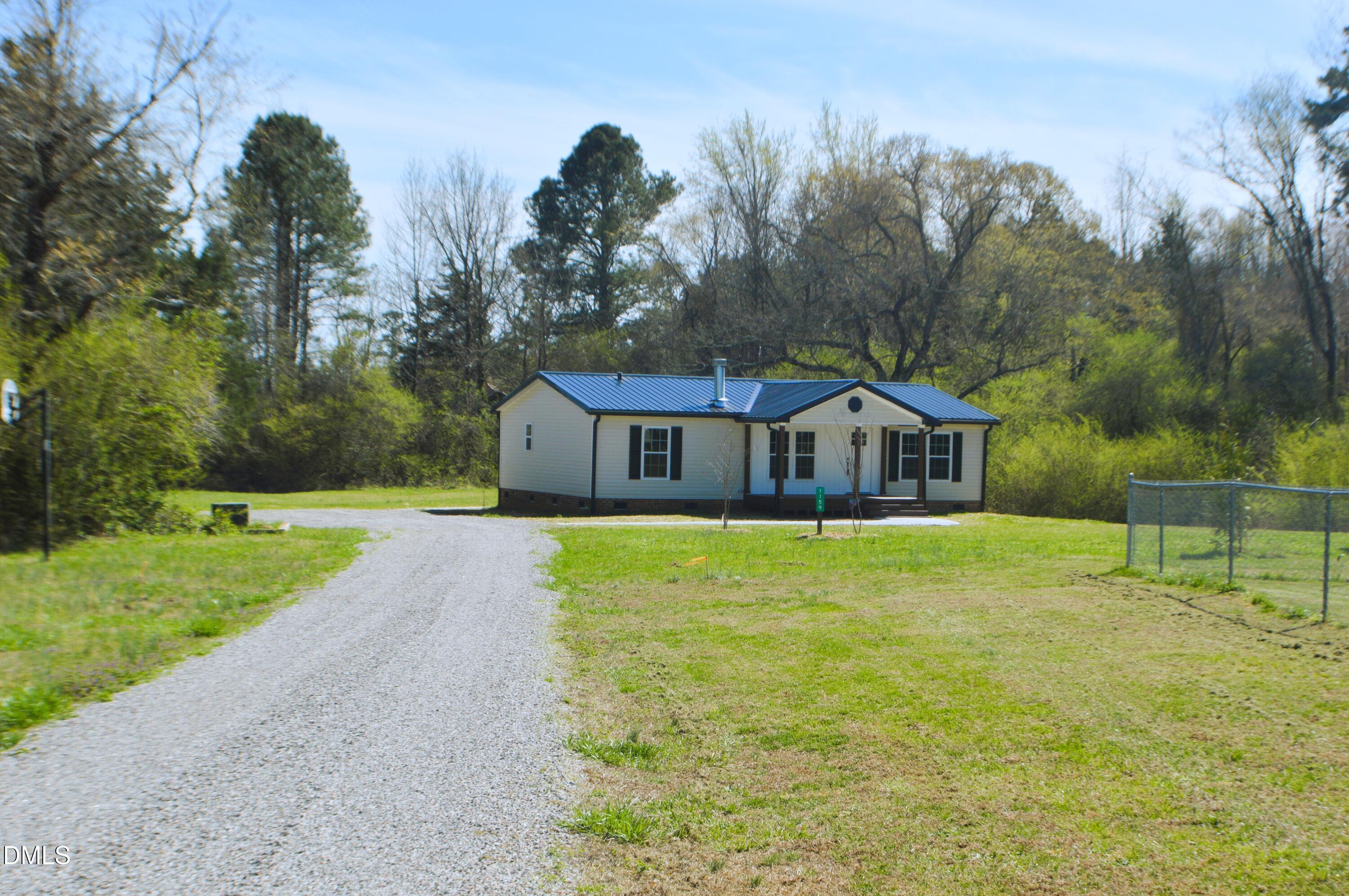 1159 No Bottom Road Warrenton, NC 27589 - Photo 42 of 43 a front view of a house with a yard