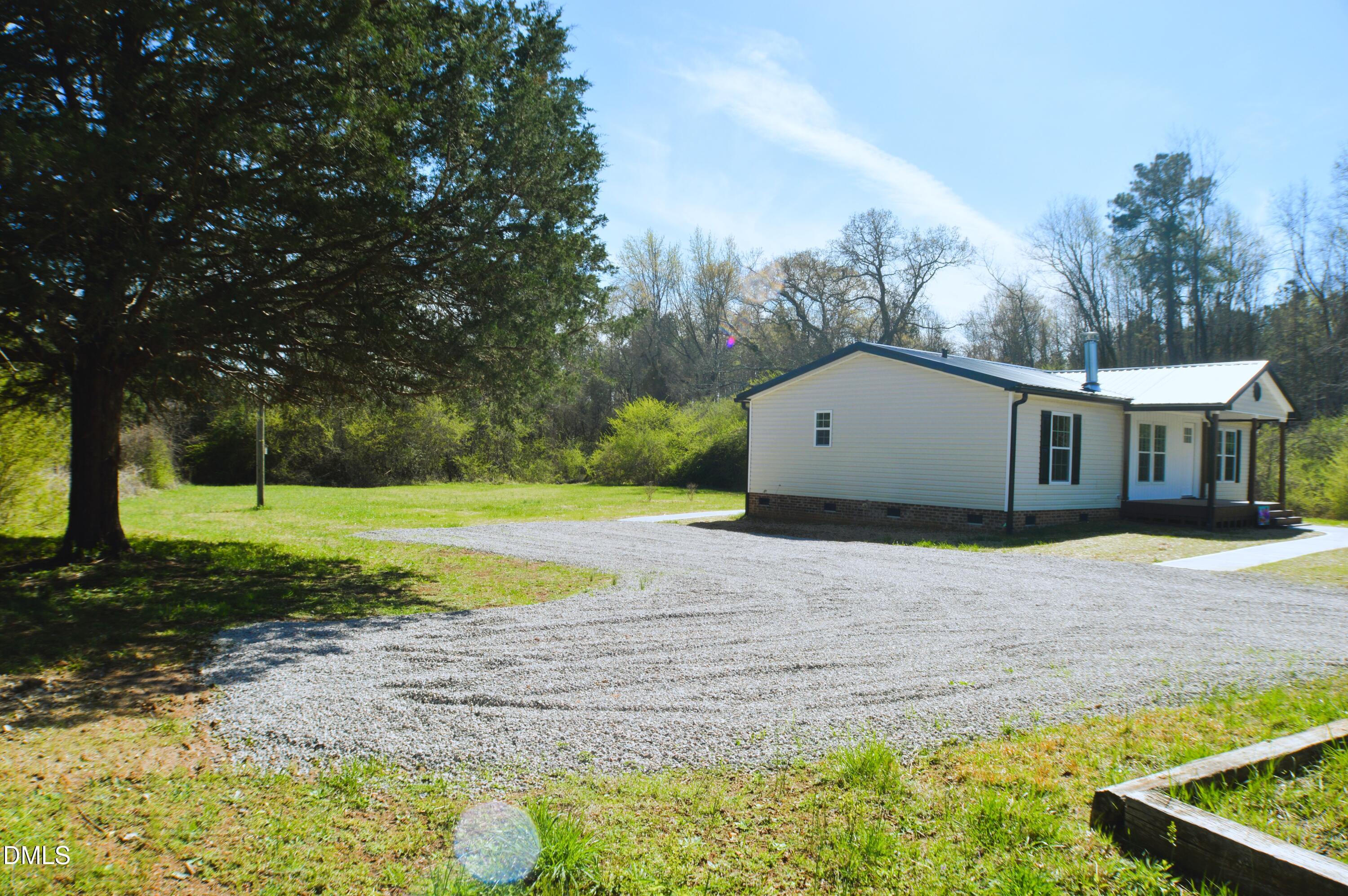 1159 No Bottom Road Warrenton, NC 27589 - Photo 5 of 44 a view of a house with backyard and trees