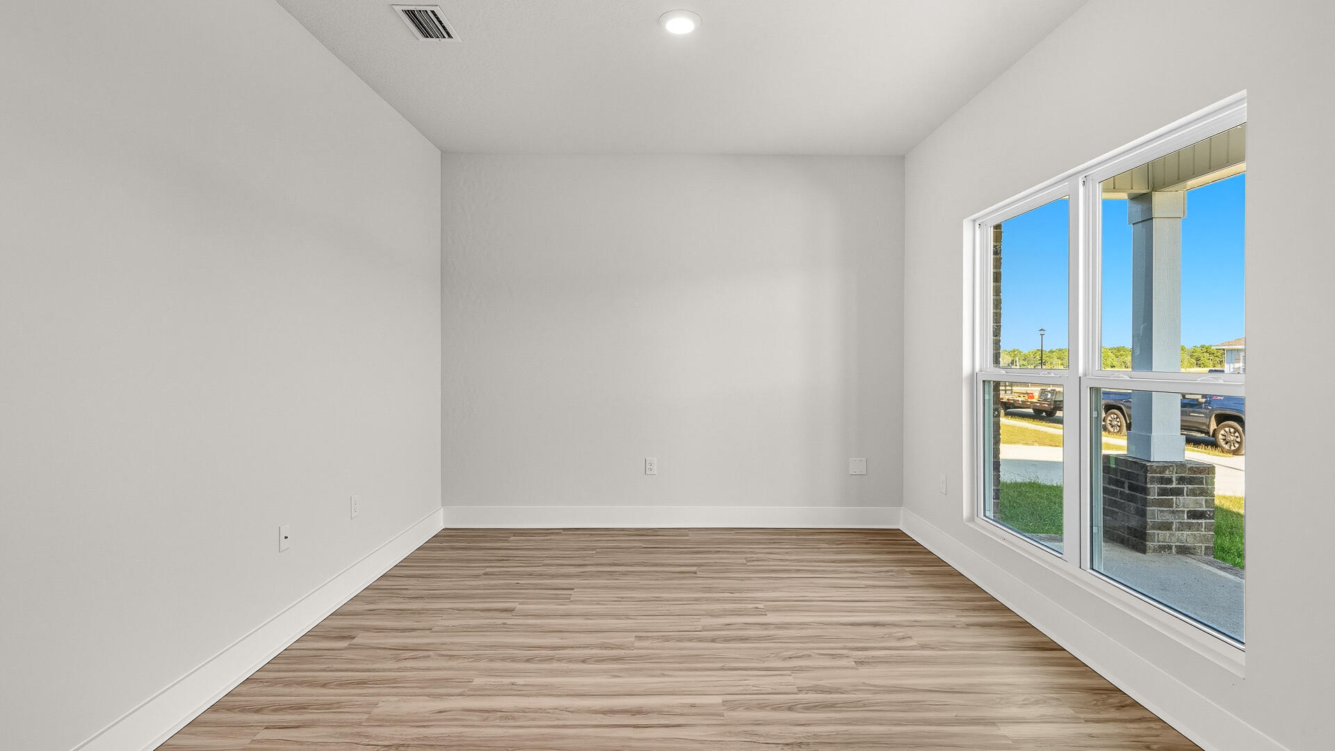 2508 Rutgers Road Crestview, FL 32536 - Photo 3 of 36 a view of empty room with wooden floor and fan