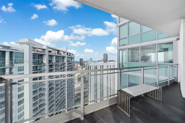 a view of a balcony with chairs