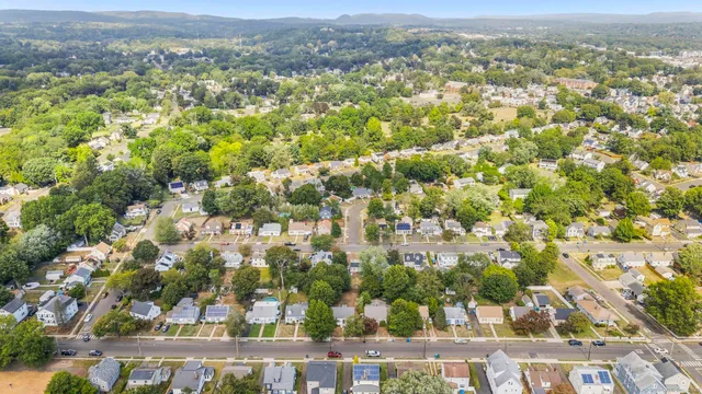 an aerial view of a house with outdoor space and street view