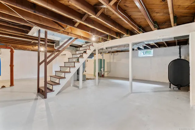 a front view of a house with potted plants