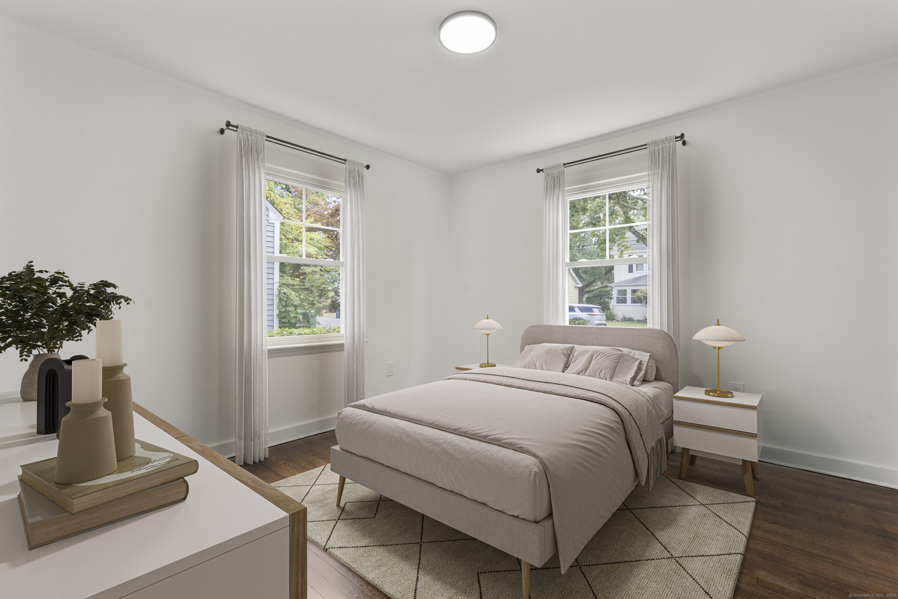 203 Gorham Avenue Hamden, CT 06514 - Photo 6 of 31 a bedroom with a bed and a potted plant