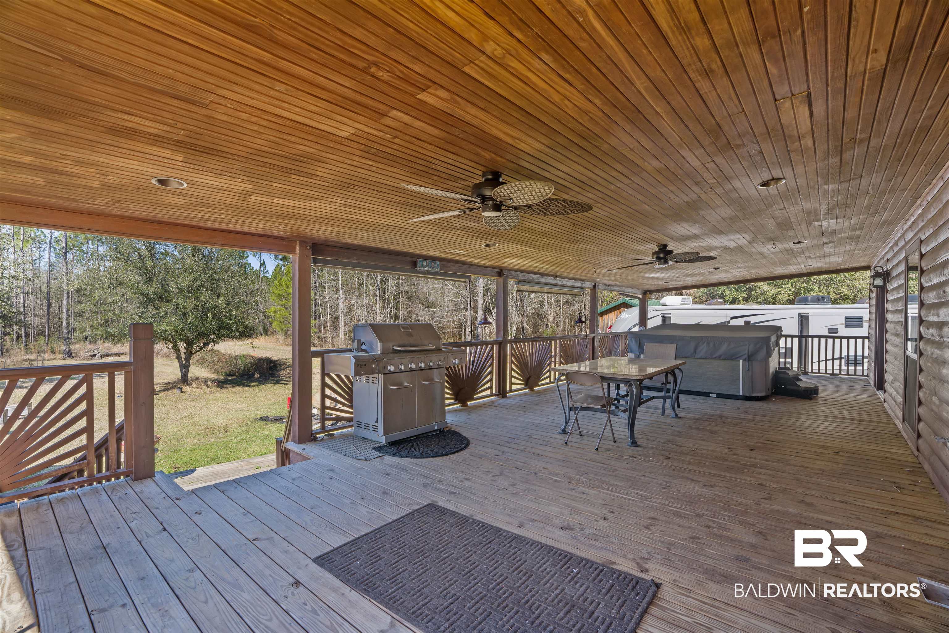 51699 Highway 31 Perdido, AL 36562 - Photo 5 of 30 Deck featuring a hot tub, grilling area, and a ceiling fan