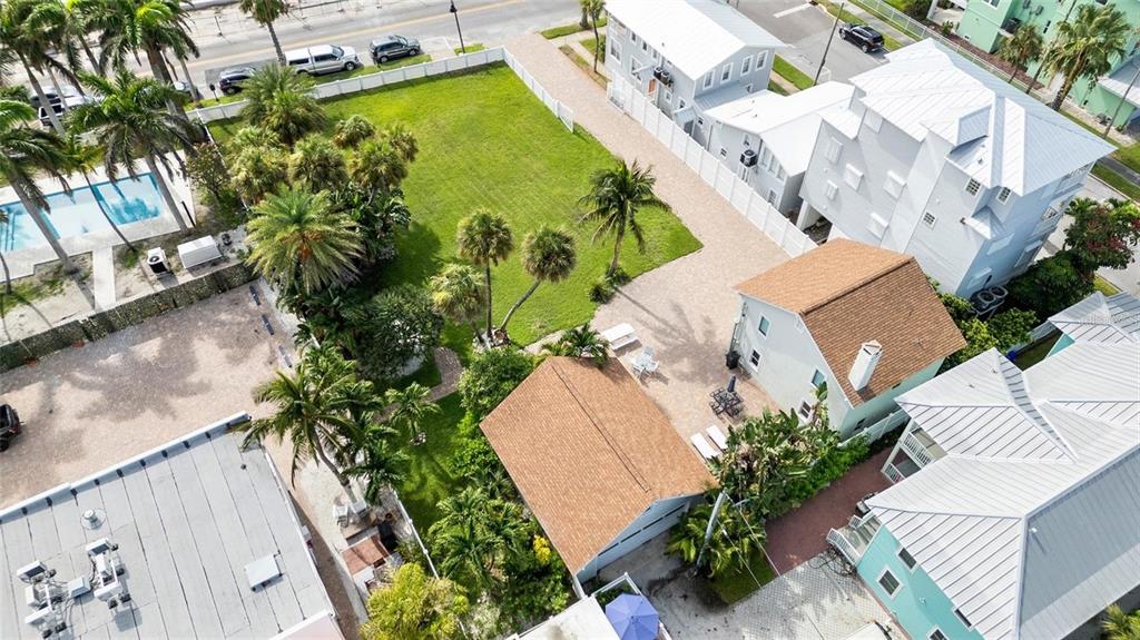 702 Pass A Grille Way St. Pete Beach, FL 33706 - Photo 9 of 41 an aerial view of a house with a yard and a garden