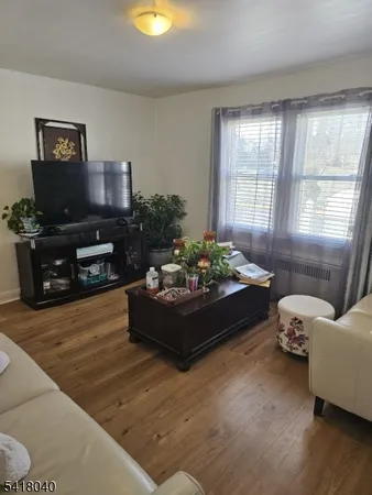 a kitchen with stainless steel appliances a sink a stove a microwave and cabinets