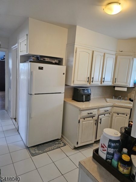 836 Summit Street Linden, NJ 07036 - Photo 8 of 10 a kitchen with stainless steel appliances granite countertop a refrigerator sink and stove