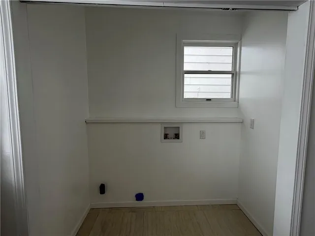 a kitchen with granite countertop a stove a sink and a refrigerator