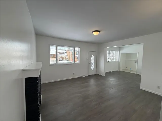 a view of entryway with wooden floor