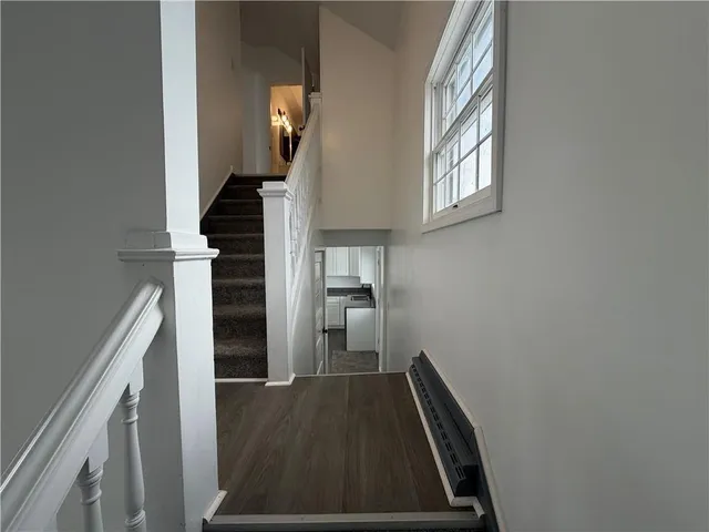 a bathroom with a bathtub a sink and a mirror