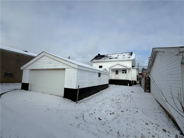 a kitchen with granite countertop a sink and cabinets