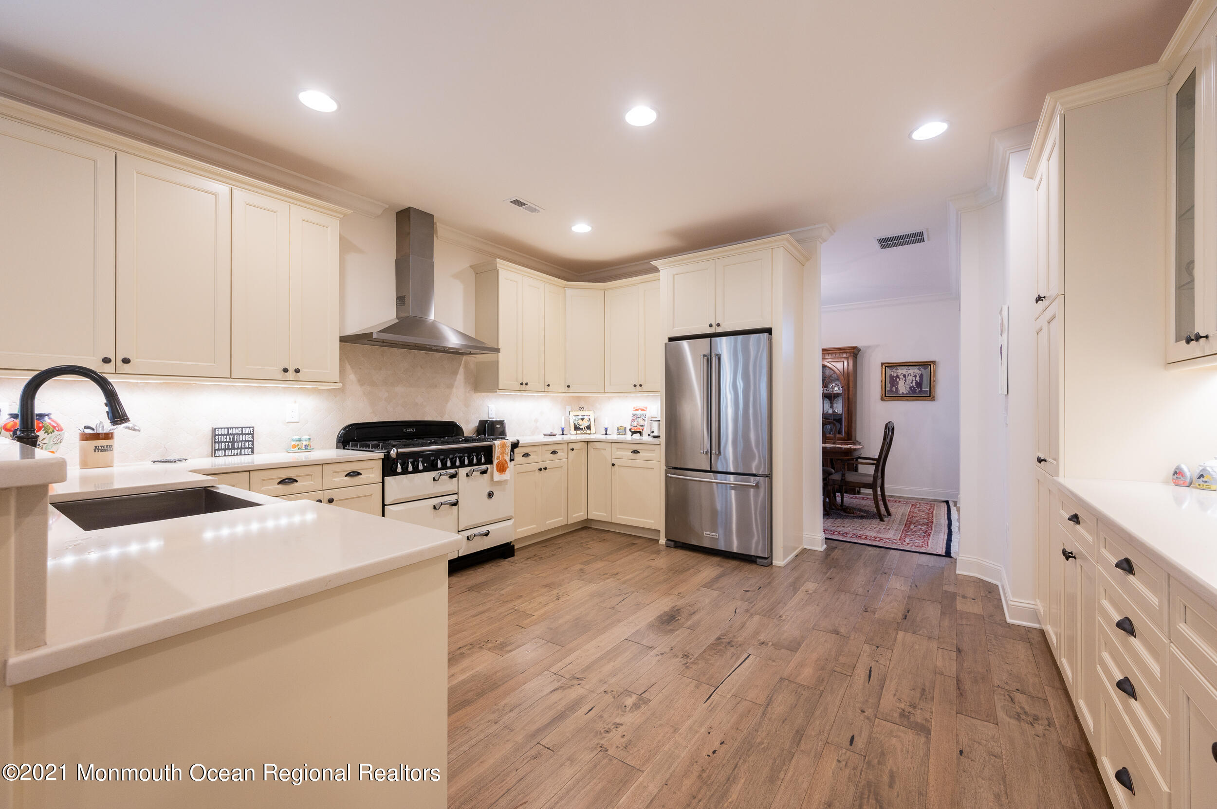 15 Starry Lane Barnegat, NJ 08005 - Photo 17 of 45 a kitchen with refrigerator cabinets and wooden floor