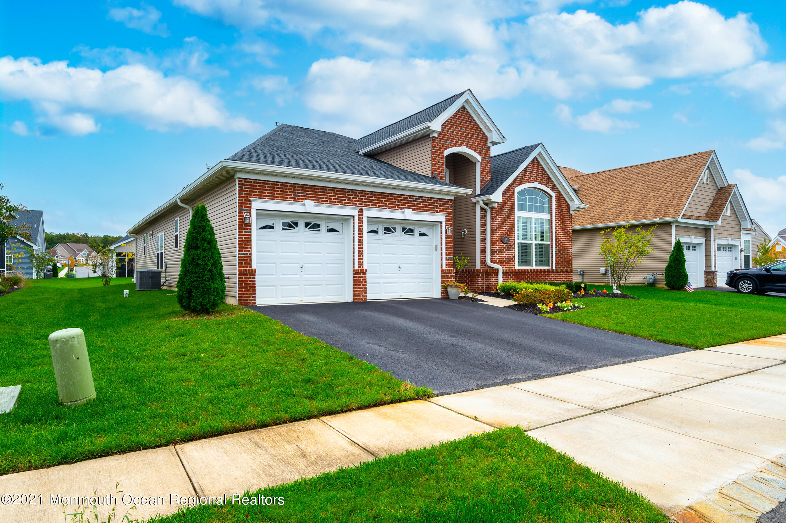 15 Starry Lane Barnegat, NJ 08005 - Photo 33 of 45 a front view of a house with a yard and garage