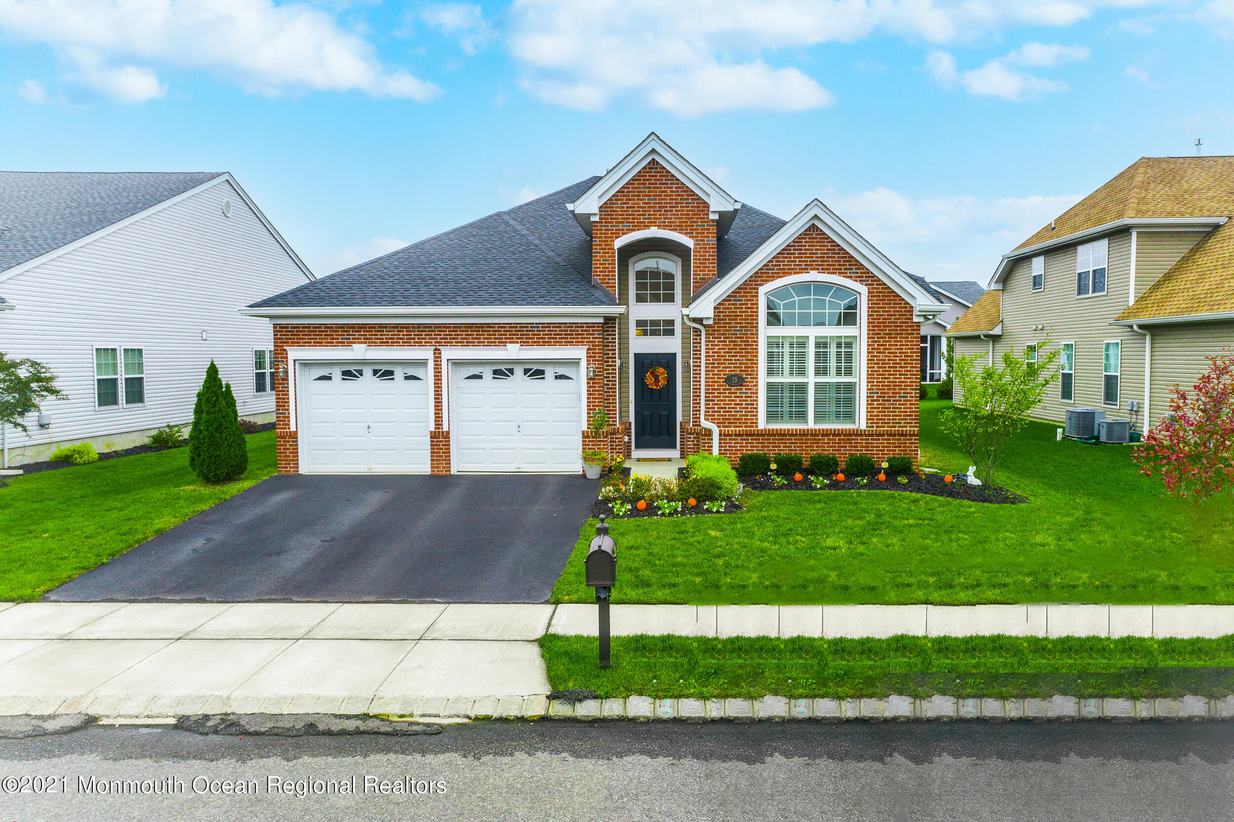 15 Starry Lane Barnegat, NJ 08005 - Photo 36 of 45 a front view of a house with a yard and garage