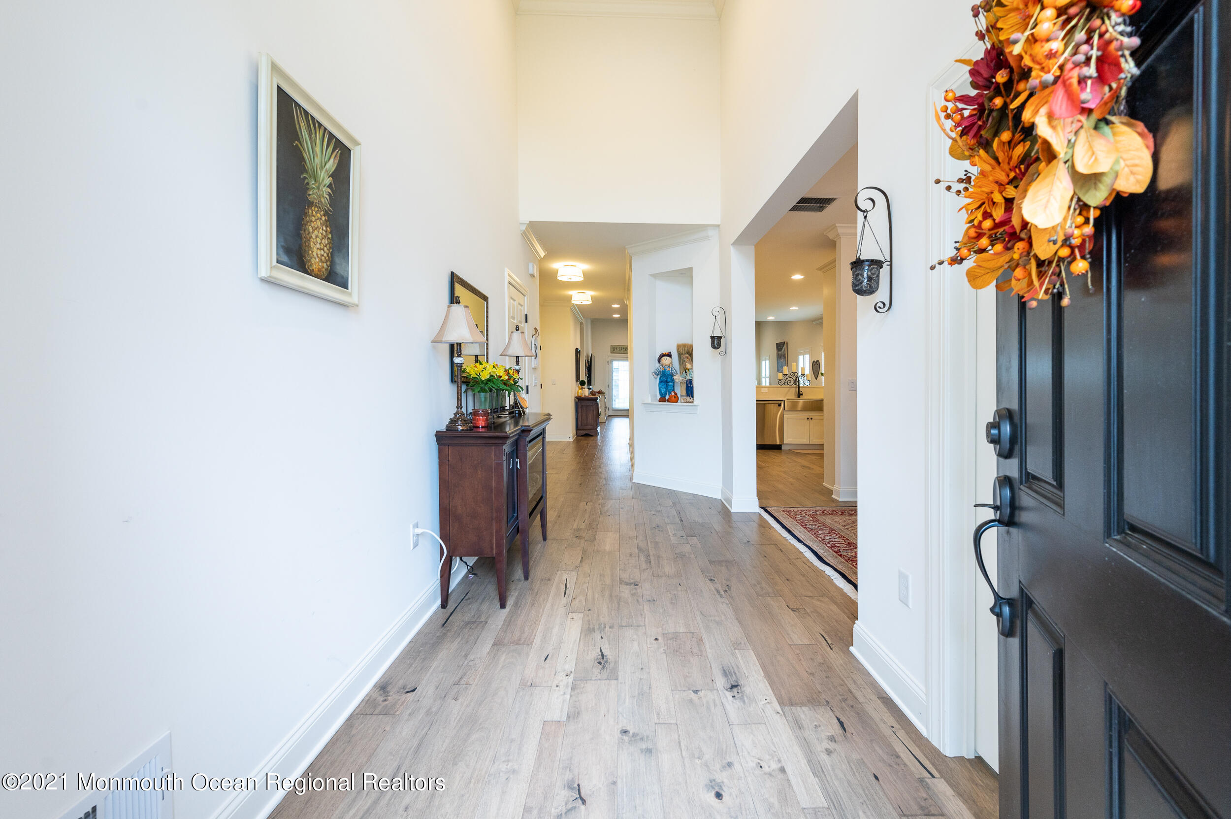 15 Starry Lane Barnegat, NJ 08005 - Photo 5 of 45 a view of a hallway with wooden floor and a living room