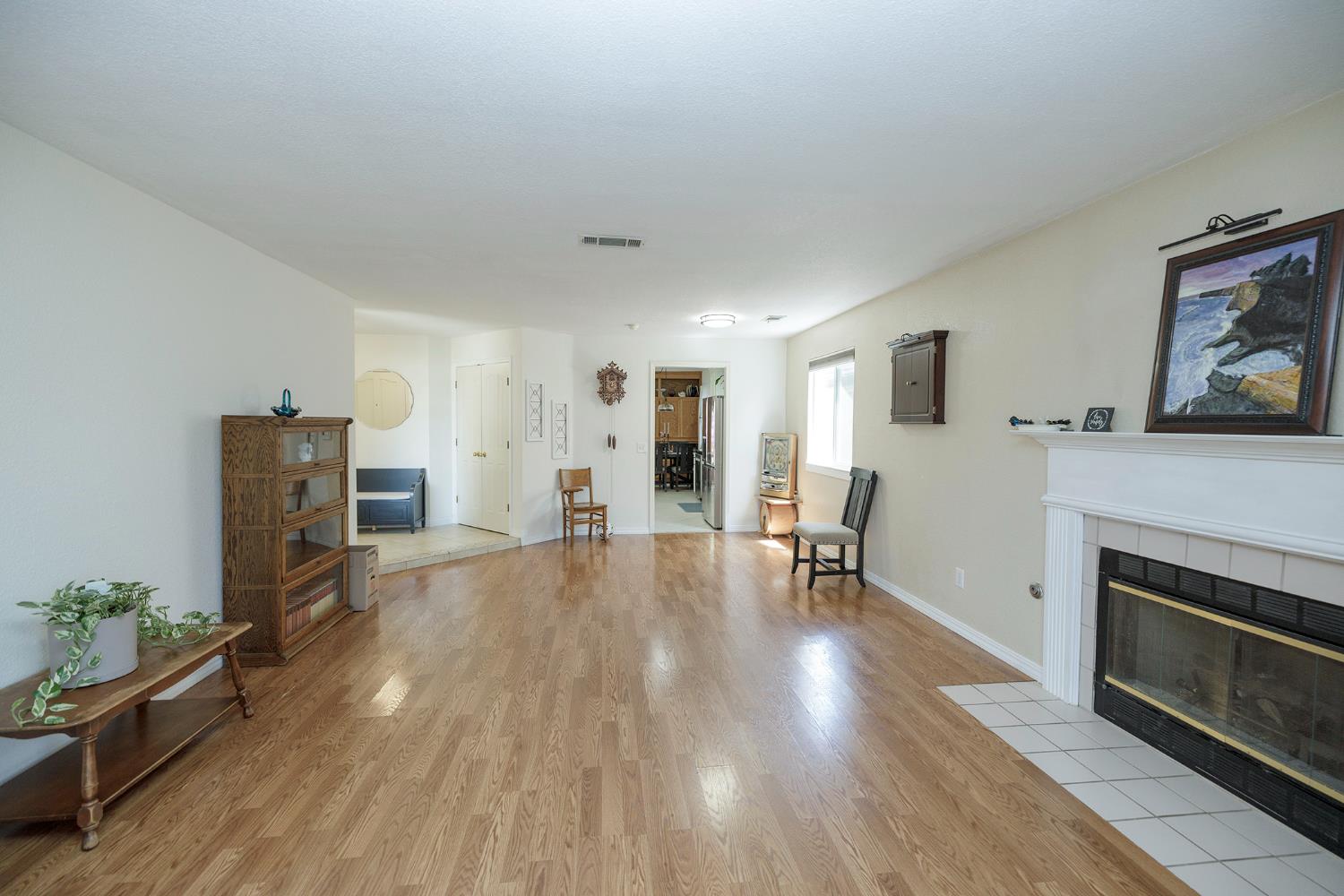 230 Meyenberg Avenue Ripon, CA 95366 - Photo 12 of 52 a living room with furniture and a fireplace