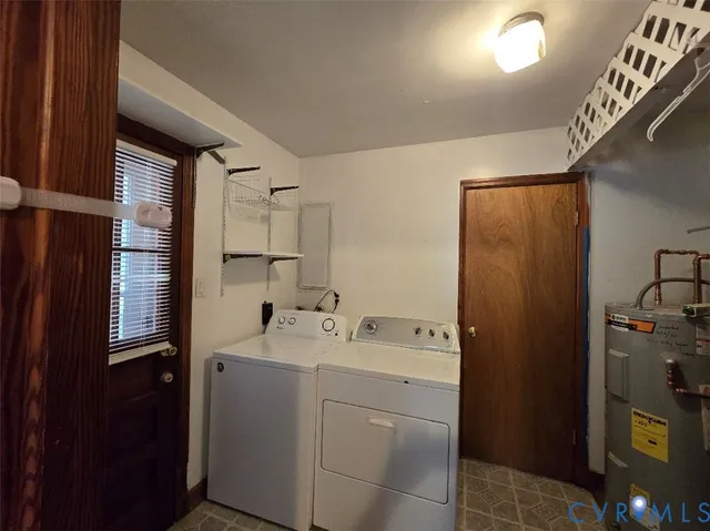 a utility room with closet dryer and washer