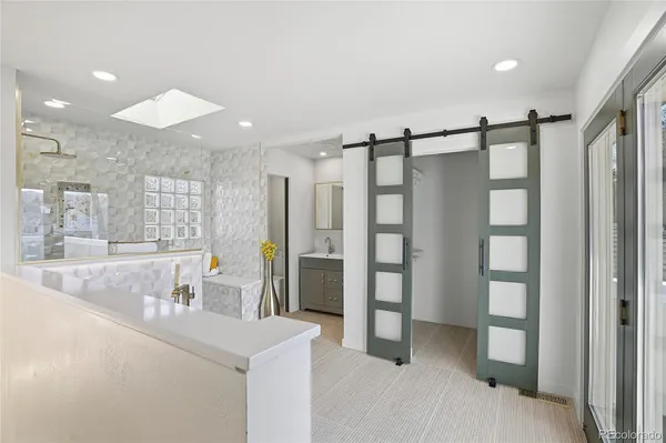 a bathroom with a double vanity sink and a mirror