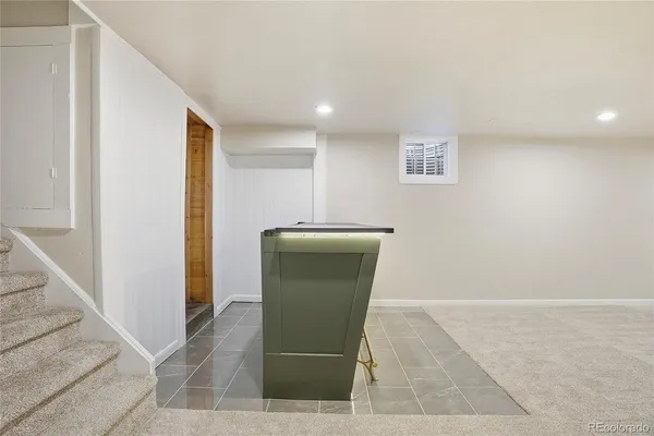 a view of a hallway with seating area