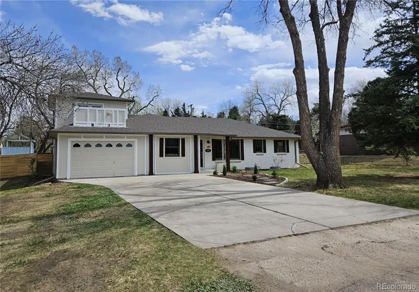 a front view of a house with yard