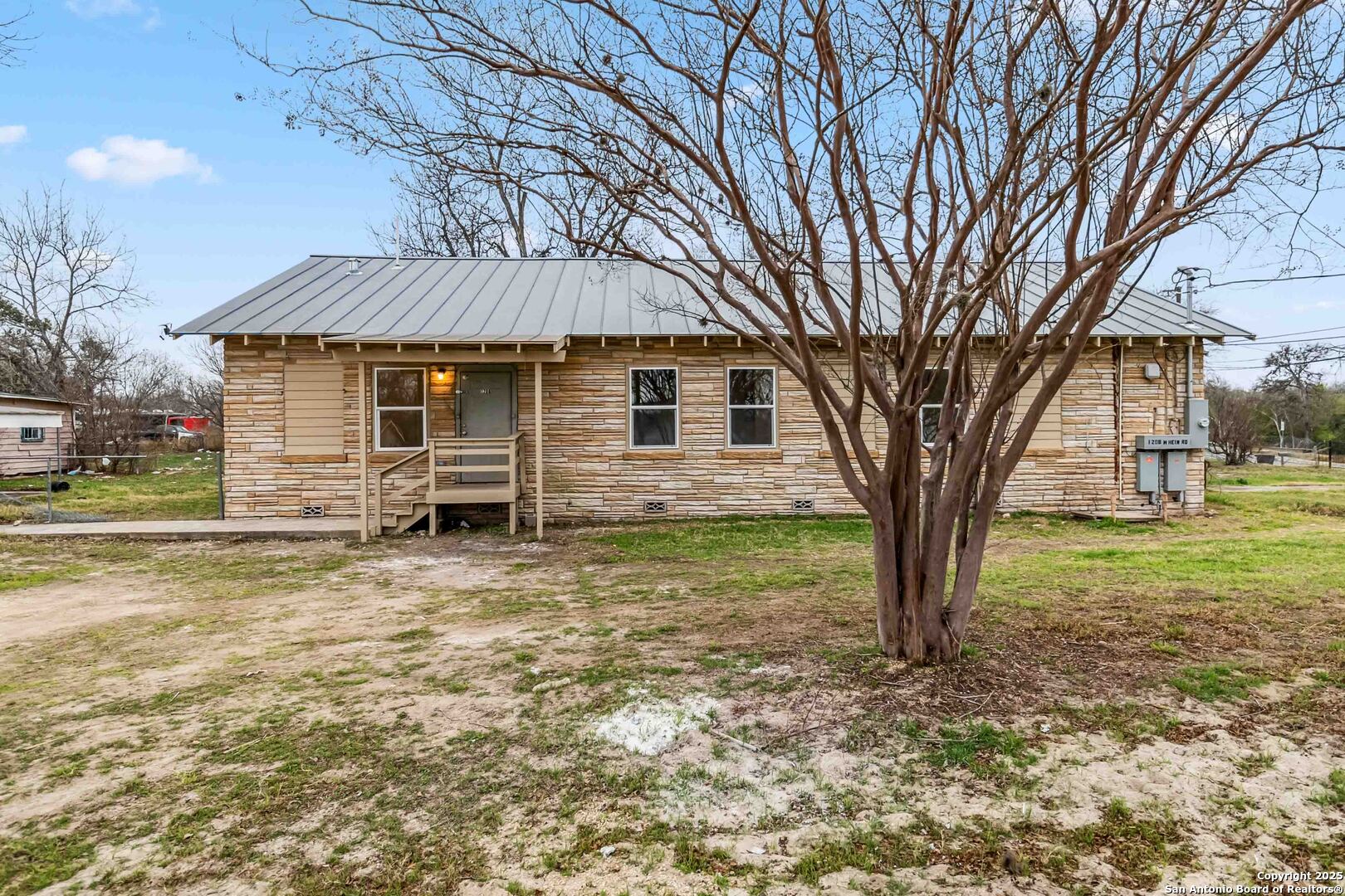1206 West Hein Road, Unit 102 San Antonio, TX 78220 - Photo 2 of 7 a front view of a house with a yard