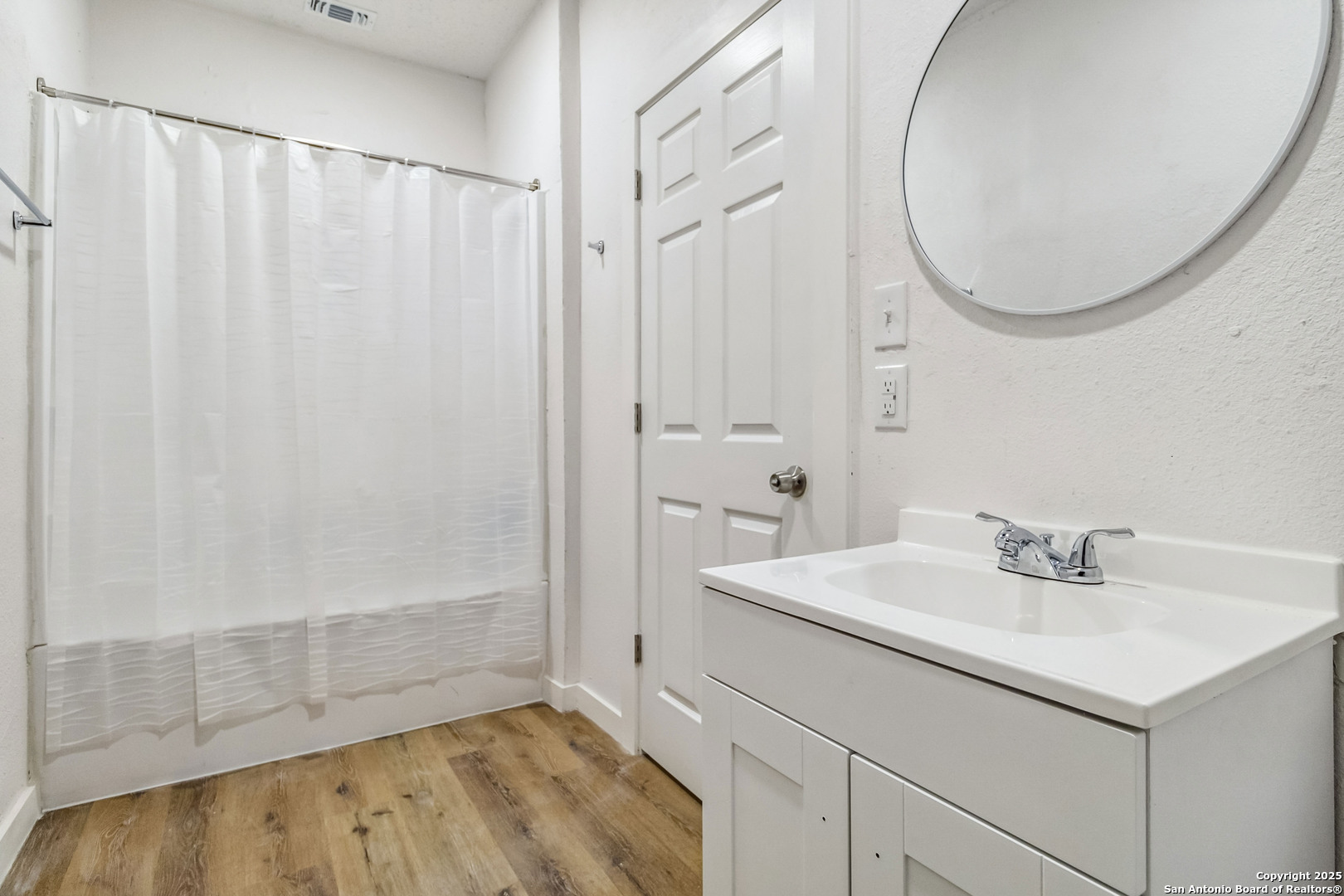1206 West Hein Road, Unit 102 San Antonio, TX 78220 - Photo 5 of 7 a bathroom with a sink and a mirror