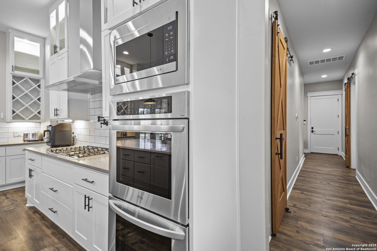 209 River Ridge Boerne, TX 78006 - Photo 13 of 60 a kitchen with stainless steel appliances granite countertop a stove and a refrigerator