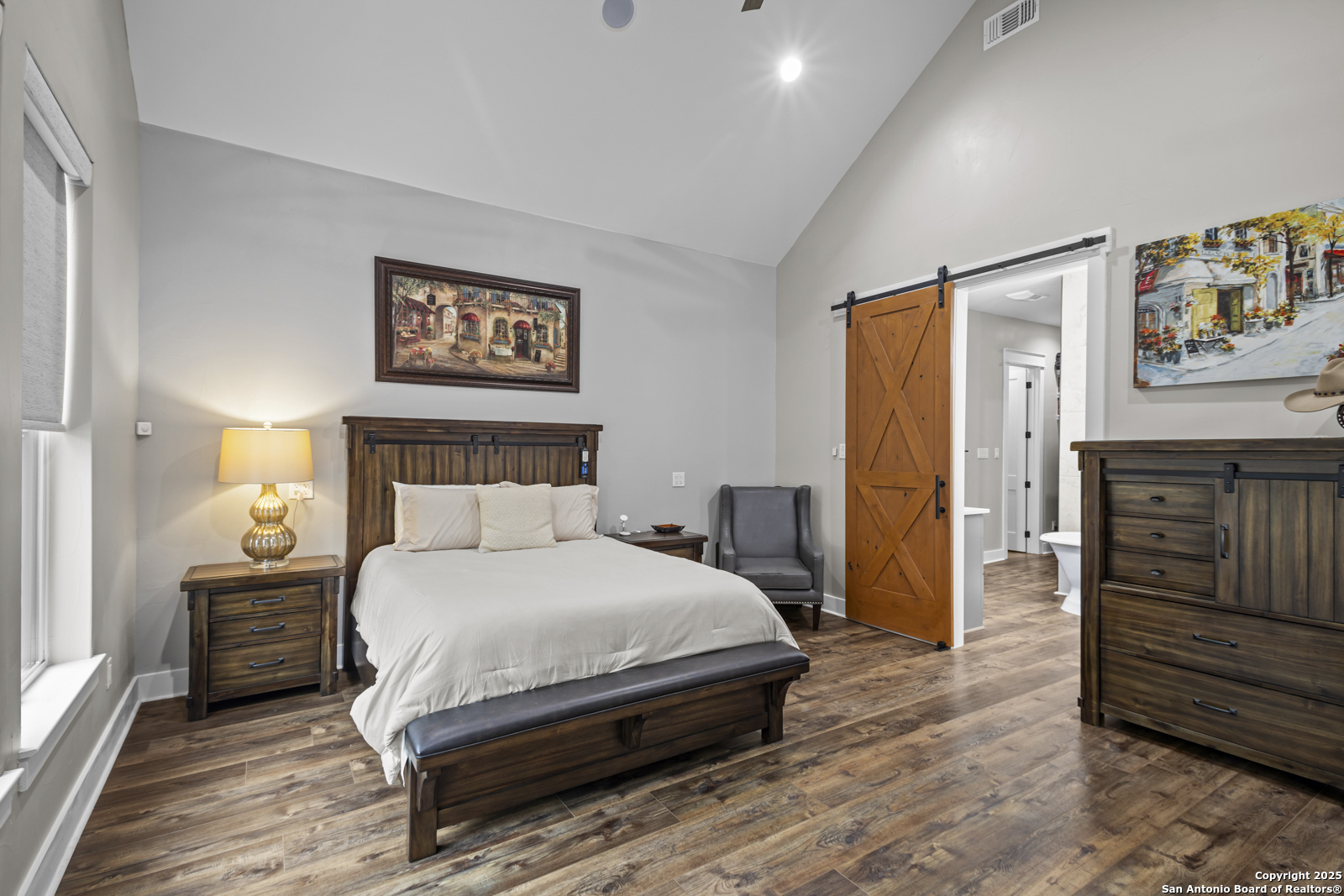 209 River Ridge Boerne, TX 78006 - Photo 19 of 60 a bedroom with a bed and wooden floor