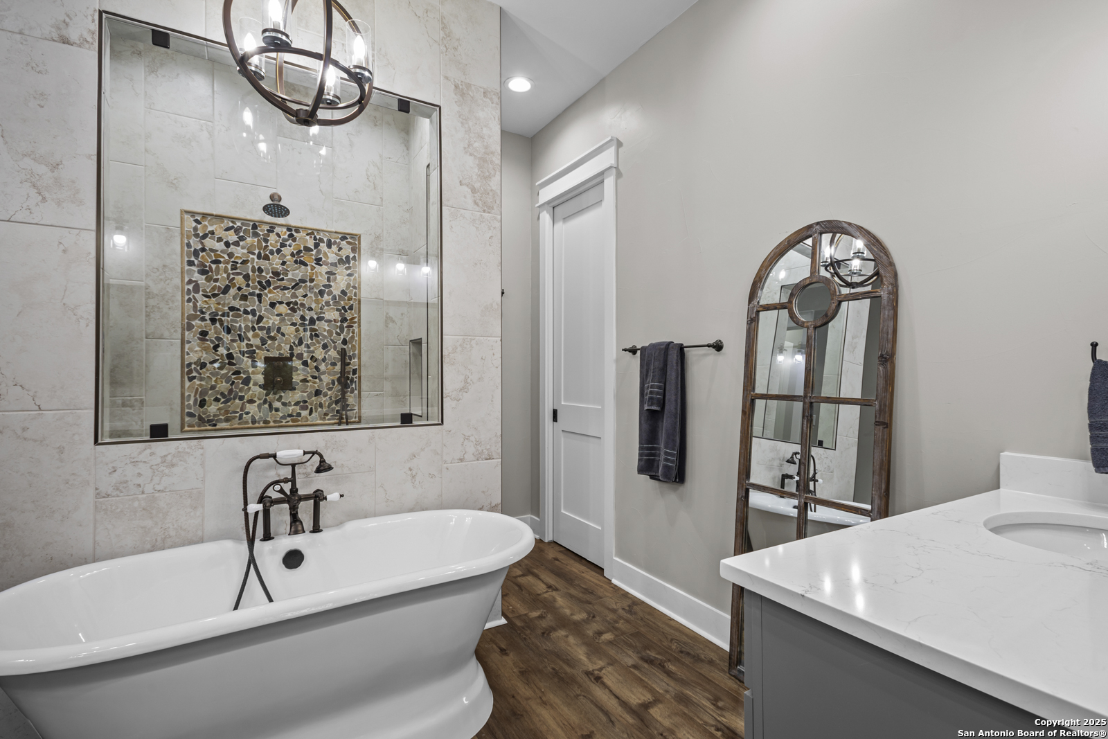 209 River Ridge Boerne, TX 78006 - Photo 21 of 60 a bathroom with a sink a mirror and a bathtub
