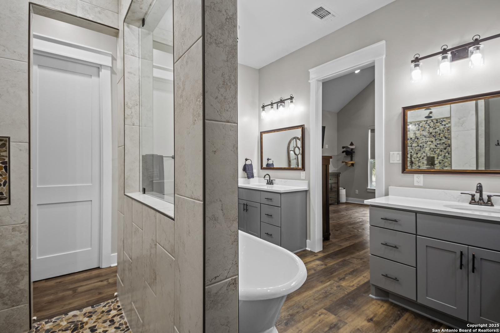 209 River Ridge Boerne, TX 78006 - Photo 23 of 60 a bathroom with a toilet sink and mirror