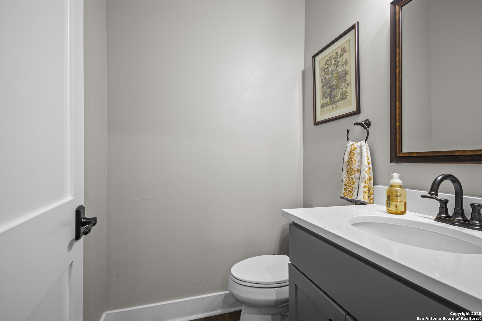 209 River Ridge Boerne, TX 78006 - Photo 27 of 60 a bathroom with a toilet sink and mirror