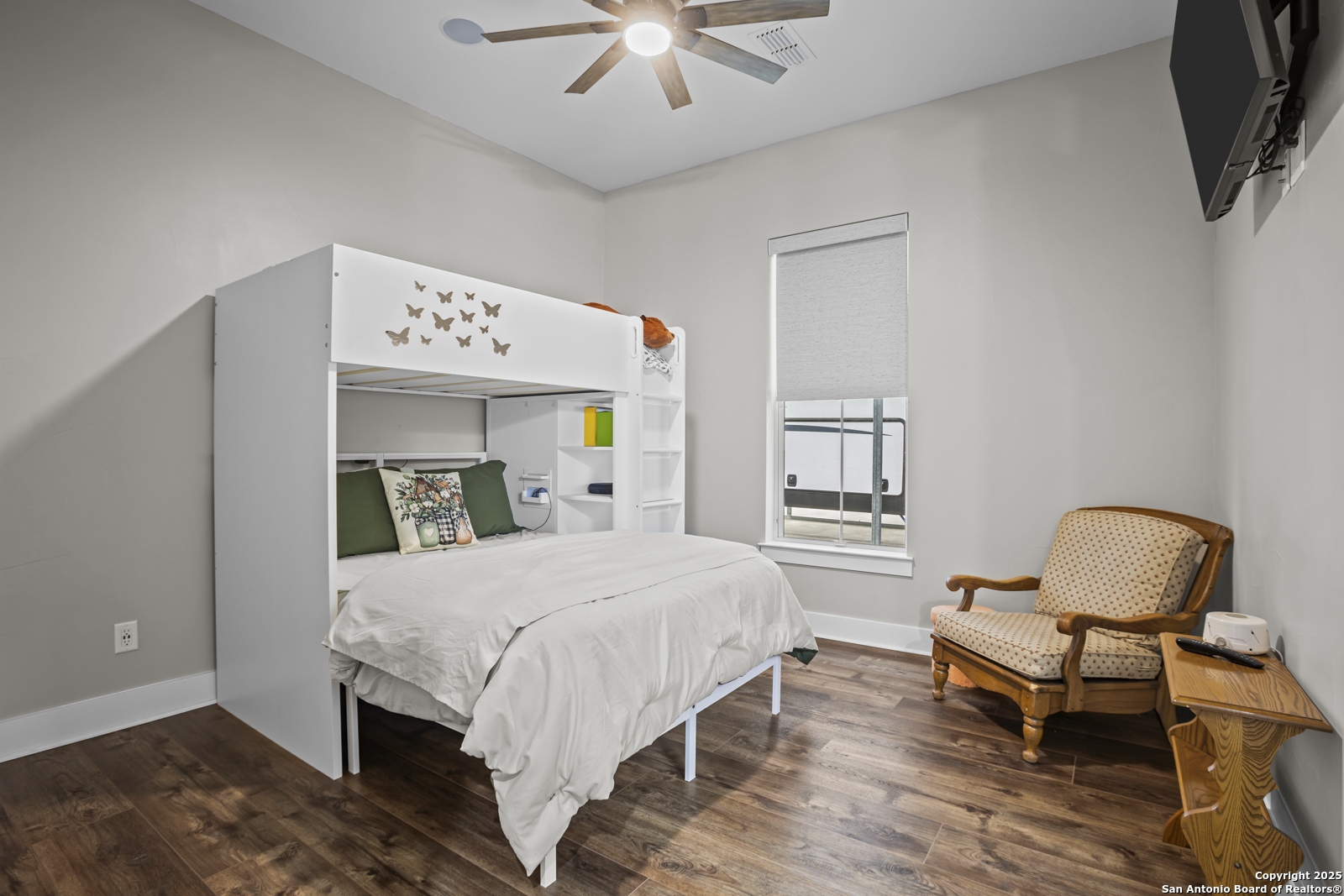 209 River Ridge Boerne, TX 78006 - Photo 28 of 60 a bedroom with a bed and a chandelier