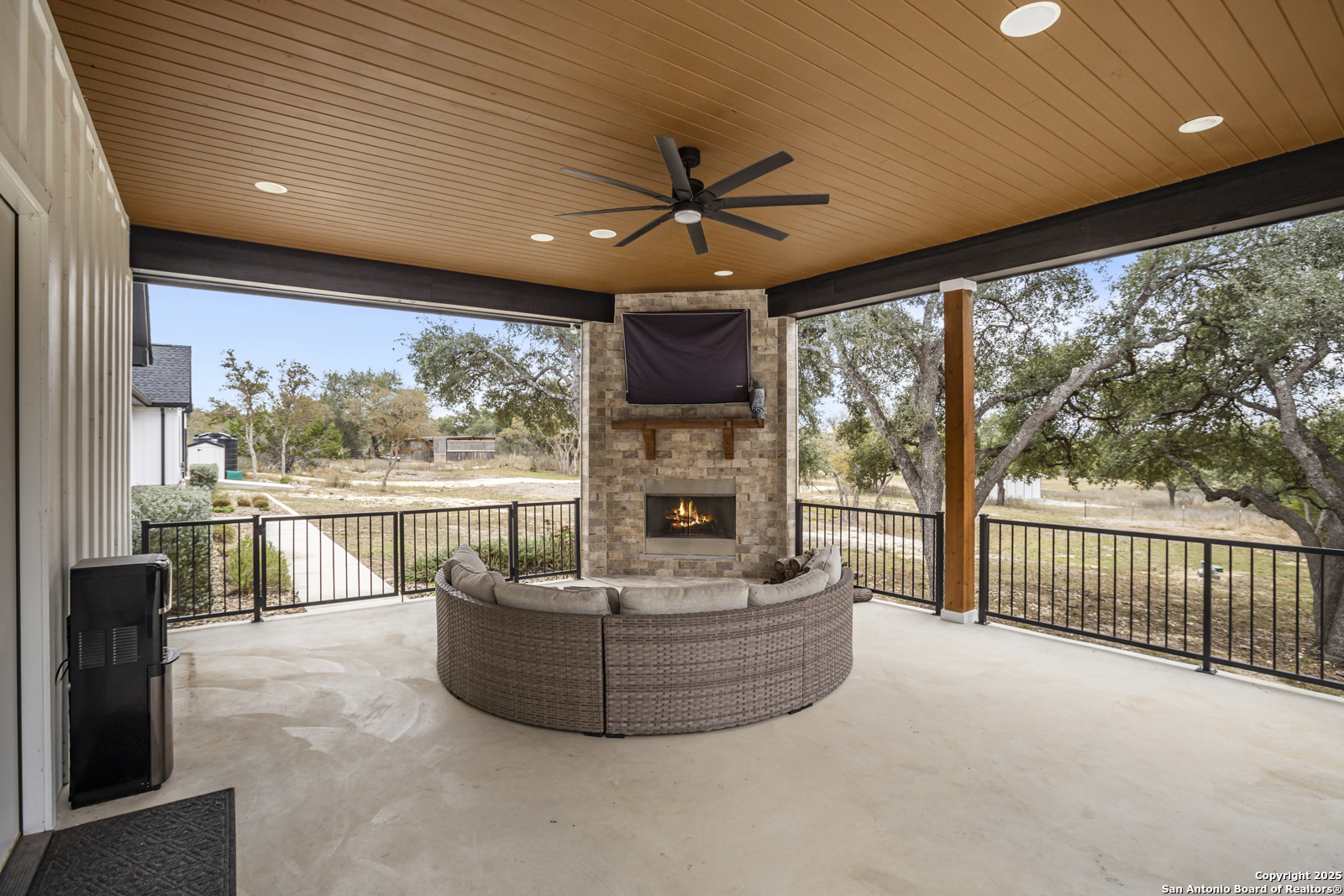 209 River Ridge Boerne, TX 78006 - Photo 38 of 60 a living room with fireplace furniture and a large window