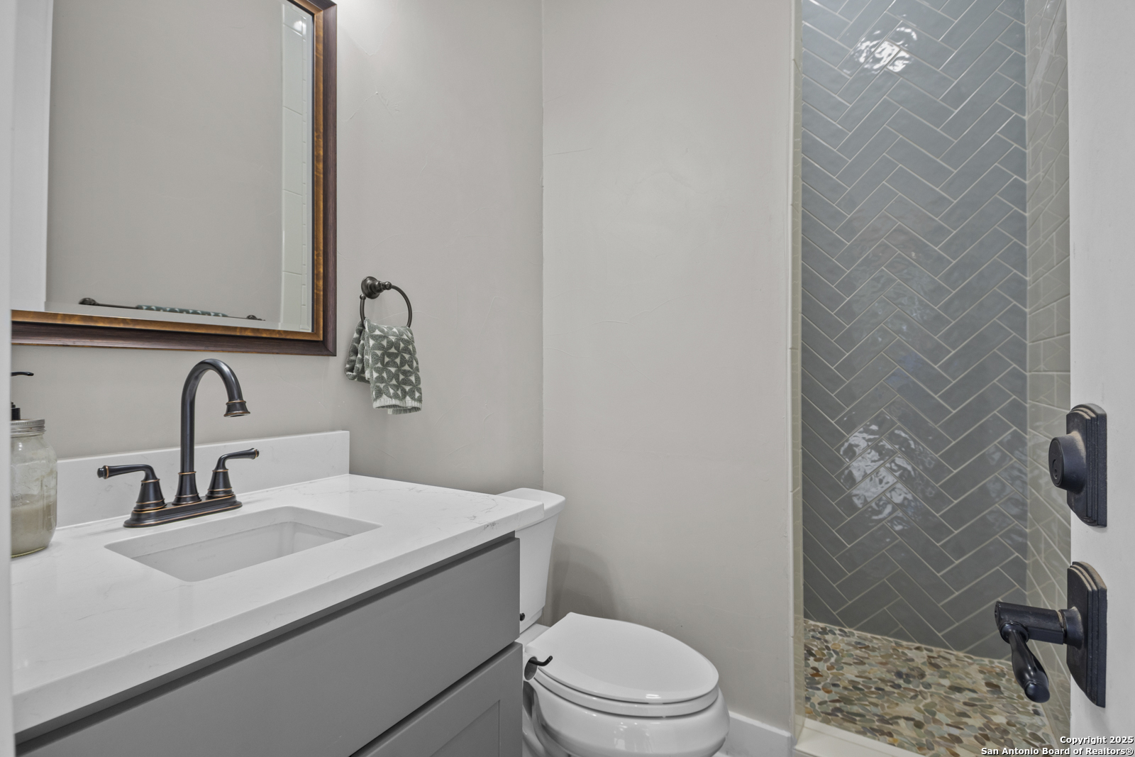 209 River Ridge Boerne, TX 78006 - Photo 39 of 60 a bathroom with a sink a toilet and shower