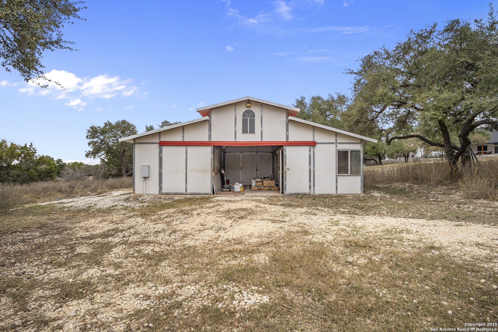 209 River Ridge Boerne, TX 78006 - Photo 47 of 60 a front view of a house with a yard and garage