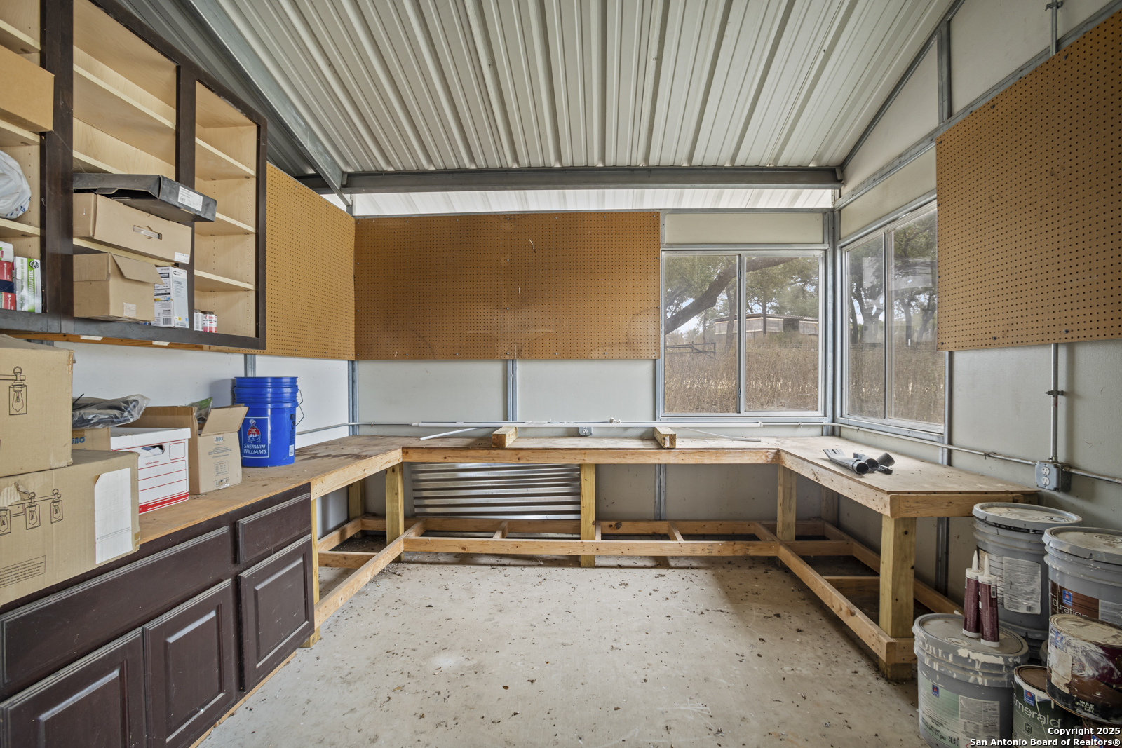 209 River Ridge Boerne, TX 78006 - Photo 49 of 60 a room with stainless steel appliances a stove window and cabinets
