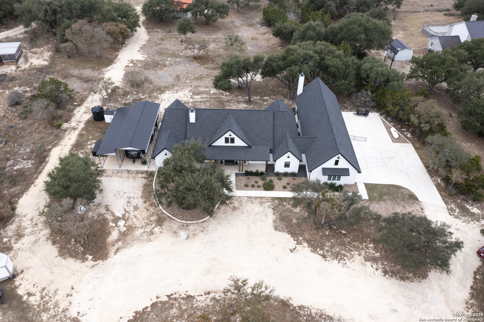 209 River Ridge Boerne, TX 78006 - Photo 52 of 60 an aerial view of a house with a yard