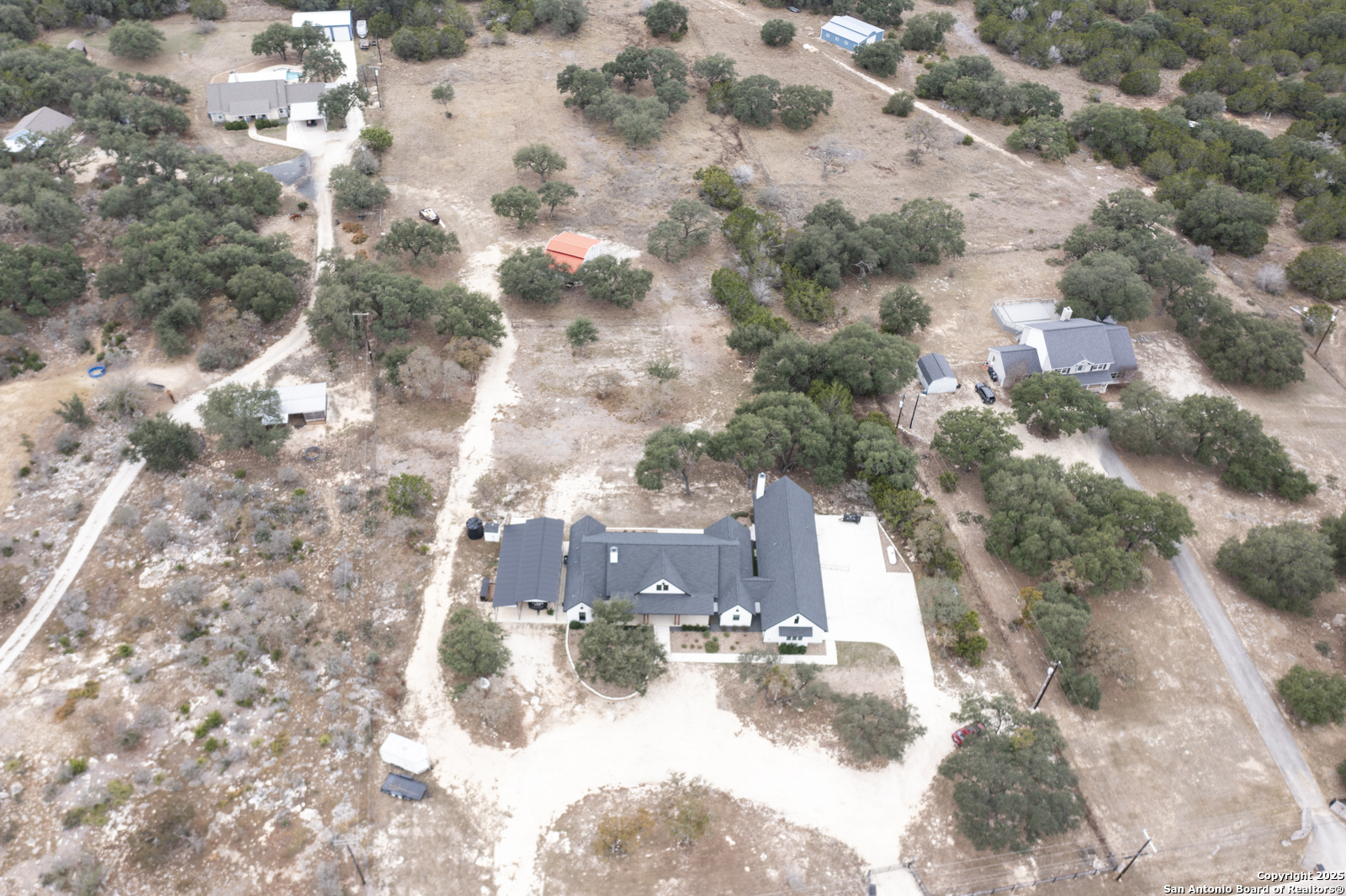 209 River Ridge Boerne, TX 78006 - Photo 53 of 60 a view of a yard with snow on the road
