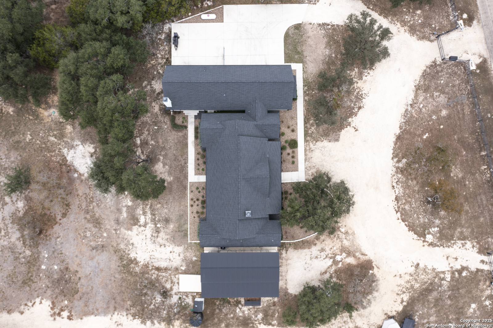 209 River Ridge Boerne, TX 78006 - Photo 58 of 60 aerial view of a house with a yard and large tree