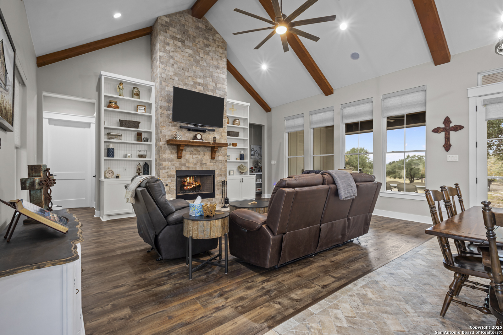 209 River Ridge Boerne, TX 78006 - Photo 6 of 60 a living room with furniture a flat screen tv and a fireplace